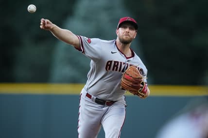 Aug 14, 2023; Denver, Colorado, USA; Arizona Diamondbacks starting pitcher Merrill Kelly (29) delivers a pitch in the first inning against the Colorado Rockies at Coors Field. Mandatory Credit: Ron Chenoy-USA TODAY Sports