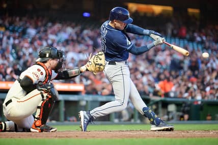 Aug 14, 2023; San Francisco, California, USA; Tampa Bay Rays infielder Curtis Mead (25) hits an infield single against the San Francisco Giants during the fifth inning at Oracle Park. Mandatory Credit: Robert Edwards-USA TODAY Sports