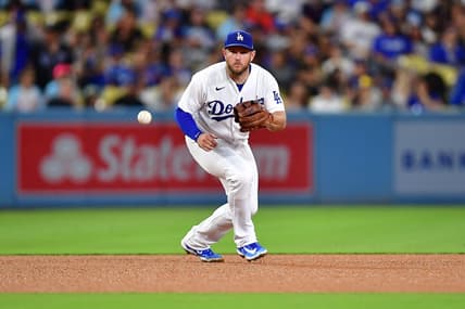 Aug 15, 2023; Los Angeles, California, USA; Los Angeles Dodgers third baseman Max Muncy (13) fields the ground ball of Milwaukee Brewers designated hitter Mark Canha (21) during the fifth inning at Dodger Stadium. Mandatory Credit: Gary A. Vasquez-USA TODAY Sports