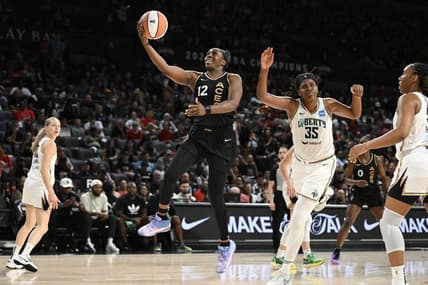 Aug 15, 2023; Las Vegas, Nevada, USA; Las Vegas Aces guard Chelsea Gray (12) drives to the basket against the New York Liberty in the second quarter at Michelob Ultra Arena. Mandatory Credit: Candice Ward-USA TODAY Sports