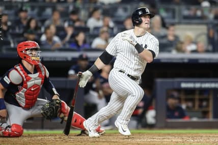 Aug 18, 2023; Bronx, New York, USA; New York Yankees left fielder Billy McKinney (57) hits a single in the fourth inning against the Boston Red Sox at Yankee Stadium. Mandatory Credit: Wendell Cruz-USA TODAY Sports