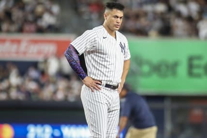 Aug 18, 2023; Bronx, New York, USA; New York Yankees right fielder Giancarlo Stanton (27) stays on the field after an inning ending double play in the sixth inning against the Boston Red Sox at Yankee Stadium. Mandatory Credit: Wendell Cruz-USA TODAY Sports