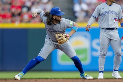 Aug 19, 2023; Cincinnati, Ohio, USA; Toronto Blue Jays shortstop Bo Bichette (11) throws to first to get the out in the third inning at Great American Ball Park. Mandatory Credit: Katie Stratman-USA TODAY Sports