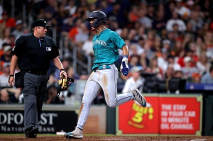Aug 19, 2023; Houston, Texas, USA; Seattle Mariners center fielder Julio Rodriguez (44) crosses home plate to score a run against the Houston Astros during the eighth inning at Minute Maid Park. Mandatory Credit: Erik Williams-USA TODAY Sports