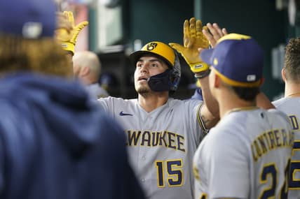 Aug 20, 2023; Arlington, Texas, USA; Milwaukee Brewers right fielder Tyrone Taylor (15) celebrates scoring a run on a double hit by Milwaukee Brewers left fielder Christian Yelich (22) against the Texas Rangers during the fourth inning at Globe Life Field. Mandatory Credit: Jim Cowsert-USA TODAY Sports