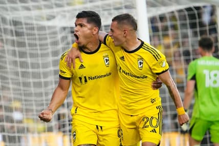 Aug 20, 2023; Columbus, Ohio, USA; Columbus Crew forward Cucho Hernandez (9) celebrates scoring a penalty kick goal with midfielder Alexandru Matan (20) behind FC Cincinnati goalkeeper Roman Celentano (18) during the first half of the MLS soccer match at Lower.com Field.