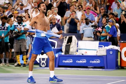Novak Djokovic, of Serbia, rips his shirt in celebration after defeating Carlos Alcaraz, of Spain, at the conclusion of the men   s singles final of the Western & Southern Open tennis tournament, Sunday, Aug. 20, 2023, at the Lindner Family Tennis Center in Mason, Ohio. Djokovic won, 5-7, 7-6, 7-6.