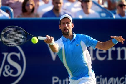 Novak Djokovic, of Serbia returns a shot to Carlos Alcaraz, of Spain, during the men   s singles final of the Western & Southern Open tennis tournament, Sunday, Aug. 20, 2023, at the Lindner Family Tennis Center in Mason, Ohio.