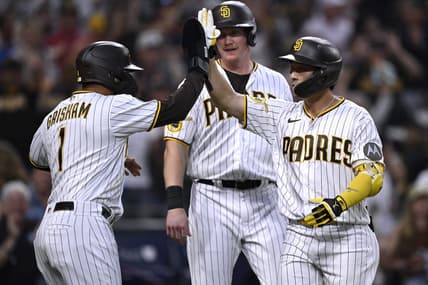 Aug 21, 2023; San Diego, California, USA; San Diego Padres second baseman Ha-seong Kim (7) is congratulated by center fielder Trent Grisham (1) after hitting a grand slam home run against the Miami Marlins during the second inning at Petco Park. Mandatory Credit: Orlando Ramirez-USA TODAY Sports