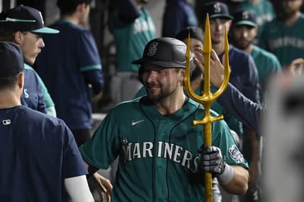 Aug 21, 2023; Chicago, Illinois, USA;  Seattle Mariners catcher Cal Raleigh (29) celebrates in the dugout after he hits a three run home run against the Chicago White Sox during the eighth inning at Guaranteed Rate Field. Mandatory Credit: Matt Marton-USA TODAY Sports