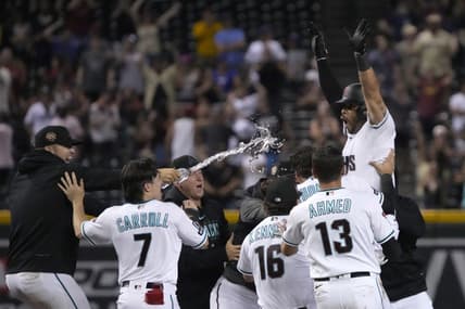 Aug 21, 2023; Phoenix, Arizona, USA; Arizona Diamondbacks left fielder Tommy Pham (28) celebrates with temamates after hitting a two run walk off double during the eleventh inning against the Texas Rangers at Chase Field. Mandatory Credit: Rick Scuteri-USA TODAY Sports