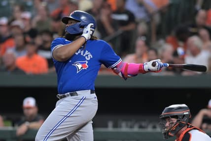 Aug 22, 2023; Baltimore, Maryland, USA;  Toronto Blue Jays first baseman Vladimir Guerrero Jr. (27) singles to center field during the third inning against the Baltimore Orioles at Oriole Park at Camden Yards. Mandatory Credit: Tommy Gilligan-USA TODAY Sports