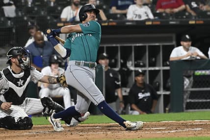 Aug 22, 2023; Chicago, Illinois, USA; Seattle Mariners third baseman Josh Rojas (4) hits a two run home run against the Chicago White Sox during the fourth inning at Guaranteed Rate Field. Mandatory Credit: Matt Marton-USA TODAY Sports