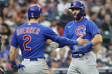 Aug 23, 2023; Detroit, Michigan, USA;  Chicago Cubs second baseman Nico Hoerner (2) and shortstop Dansby Swanson (7) congratulate each other after scoring in the third inning against the Detroit Tigers at Comerica Park. Mandatory Credit: Rick Osentoski-USA TODAY Sports