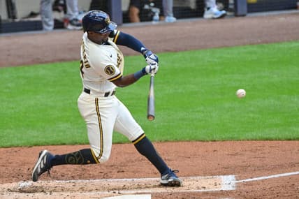 Aug 23, 2023; Milwaukee, Wisconsin, USA; Milwaukee Brewers third baseman Andruw Monasterio (14) drives in two runs with a base hit against the Minnesota Twins in the first inning at American Family Field. Mandatory Credit: Benny Sieu-USA TODAY Sports