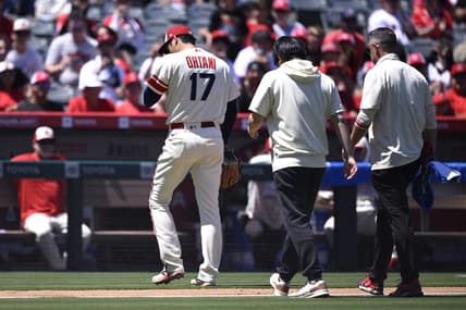 Aug 23, 2023; Anaheim, California, USA; Los Angeles Angels starting pitcher Shohei Ohtani (17) leaves the field during the second inning against the Cincinnati Reds at Angel Stadium. Mandatory Credit: Orlando Ramirez-USA TODAY Sports