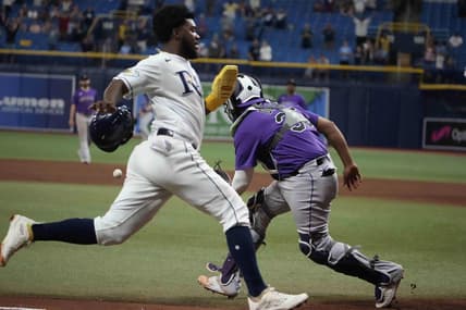 Aug 23, 2023; St. Petersburg, Florida, USA; Tampa Bay Rays shortstop Osleivis Basabe (37) scores the winning run off a hit by second baseman Brandon Lowe (8) as Colorado Rockies catcher Elias Diaz (35) tries to make the tag during the tenth inning at Tropicana Field. Mandatory Credit: Dave Nelson-USA TODAY Sports