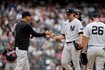 Aug 24, 2023; Bronx, New York, USA; New York Yankees manager Aaron Boone (17) takes the ball from starting pitcher Michael King (34) during the third inning against the Washington Nationals at Yankee Stadium. Mandatory Credit: Brad Penner-USA TODAY Sports