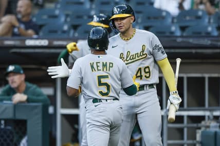 Aug 25, 2023; Chicago, Illinois, USA; Oakland Athletics second baseman Tony Kemp (5) celebrates with first baseman Ryan Noda (49) after scoring against the Chicago White Sox during the second inning at Guaranteed Rate Field. Mandatory Credit: Kamil Krzaczynski-USA TODAY Sports