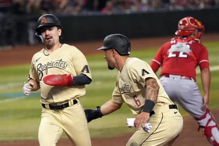 Aug 25, 2023; Phoenix, Arizona, USA; Arizona Diamondbacks third baseman Jace Peterson (6) celebrates with Arizona Diamondbacks left fielder Corbin Carroll (7) after scoring runs against the Cincinnati Reds during the fourth inning at Chase Field. Mandatory Credit: Joe Camporeale-USA TODAY Sports