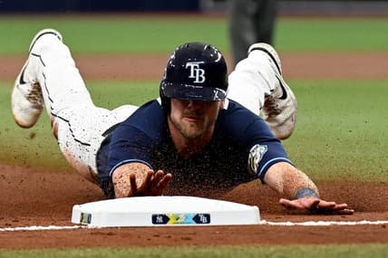 Aug 26, 2023; St. Petersburg, Florida, USA; Tampa Bay Rays center fielder Luke Raley (55) slides into third base against the New York Yankees in the second inning at Tropicana Field. Mandatory Credit: Jonathan Dyer-USA TODAY Sports