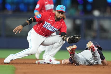 Aug 26, 2023; Miami, Florida, USA; Miami Marlins second baseman Luis Arraez (3) tags out Washington Nationals third baseman Jake Alu (39) trying to steal second base in the fifth inning at loanDepot Park. Mandatory Credit: Jim Rassol-USA TODAY Sports