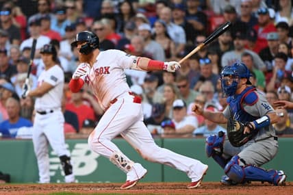 Aug 26, 2023; Boston, Massachusetts, USA;  Boston Red Sox first baseman Justin Turner (2) hits an RBI single against the Los Angeles Dodgers during the seventh inning at Fenway Park. Mandatory Credit: Bob DeChiara-USA TODAY Sports