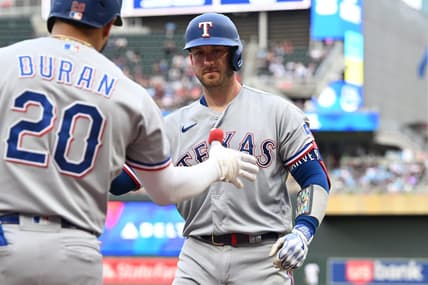 Aug 26, 2023; Minneapolis, Minnesota, USA; Texas Rangers catcher Mitch Garver (18) reacts with shortstop Ezequiel Duran (20) after hitting a home run off Minnesota Twins starting pitcher Joe Ryan (not pictured) during the second inning at Target Field. Mandatory Credit: Jeffrey Becker-USA TODAY Sports