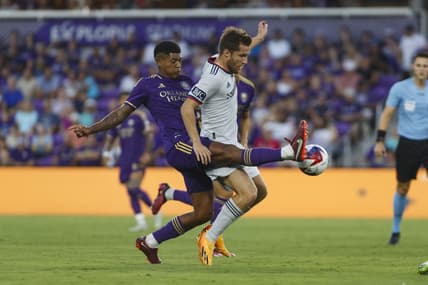 Aug 26, 2023; Orlando, Florida, USA; Orlando City SC midfielder Wilder Cartagena (16) and St. Louis City SC midfielder Indiana Vassilev (19) battle for the ball in the first half at Exploria Stadium. Mandatory Credit: Morgan Tencza-USA TODAY Sports