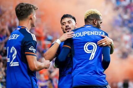 Aug 26, 2023; Cincinnati, Ohio, USA;  FC Cincinnati forward Aaron Boupendza (9) celebrates with midfielder Junior Moreno (93) after scoring a goal against New York City FC in the first half at TQL Stadium. Mandatory Credit: Aaron Doster-USA TODAY Sports