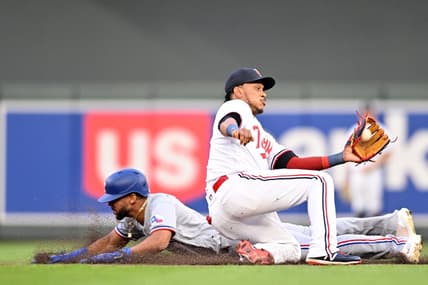 Aug 26, 2023; Minneapolis, Minnesota, USA; Texas Rangers center fielder Leody Taveras (3) slides in safe while stealing second base as Minnesota Twins second baseman Jorge Polanco (11) catches the ball to apply the tag during the fifth inning at Target Field. Mandatory Credit: Jeffrey Becker-USA TODAY Sports