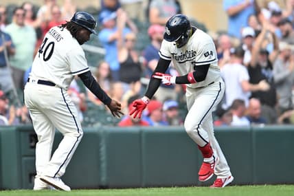 Aug 27, 2023; Minneapolis, Minnesota, USA; Minnesota Twins third baseman Royce Lewis (23) reacts with third base coach/outfield coach Tommy Watkins (40) after hitting a grand slam off Texas Rangers relief pitcher Chris Stratton (not pictured) during the sixth inning at Target Field. Mandatory Credit: Jeffrey Becker-USA TODAY Sports