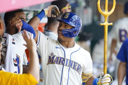 Aug 27, 2023; Seattle, Washington, USA; Seattle Mariners center fielder Julio Rodriguez (44) celebrates in the dugout after hitting a two-run home run against the Kansas City Royals during the fifth inning at T-Mobile Park. Mandatory Credit: Joe Nicholson-USA TODAY Sports
