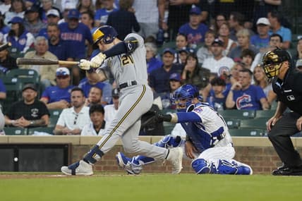 Aug 28, 2023; Chicago, Illinois, USA; Milwaukee Brewers designated hitter Mark Canha (21) hits a two-run home run against the Chicago Cubs during the first inning at Wrigley Field. Mandatory Credit: David Banks-USA TODAY Sports