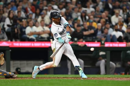 Aug 28, 2023; Seattle, Washington, USA; Seattle Mariners center fielder Julio Rodriguez (44) hits a 2-run home run against the Oakland Athletics during the third inning at T-Mobile Park. Mandatory Credit: Steven Bisig-USA TODAY Sports
