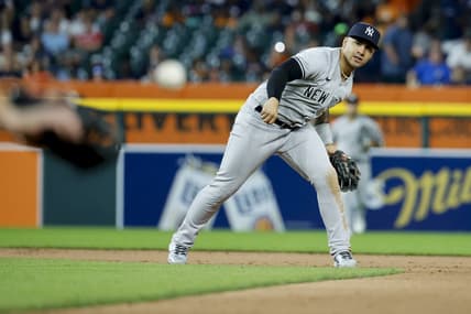 Aug 29, 2023; Detroit, Michigan, USA; New York Yankees shortstop Anthony Volpe (11) makes a throw to first to complete a double play in the seventh inning at Comerica Park. Mandatory Credit: Rick Osentoski-USA TODAY Sports