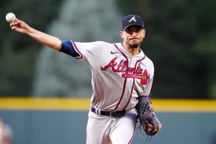Aug 29, 2023; Denver, Colorado, USA; Atlanta Braves starting pitcher Charlie Morton (50) delivers a pitch in the first inning against the Colorado Rockies at Coors Field. Mandatory Credit: Ron Chenoy-USA TODAY Sports