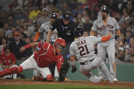 Aug 29, 2023; Boston, Massachusetts, USA;  Houston Astros catcher Yainer Diaz (21) slides safely into home plate before the tag of Boston Red Sox catcher Reese McGuire (3) during the sixth inning at Fenway Park. Mandatory Credit: Bob DeChiara-USA TODAY Sports
