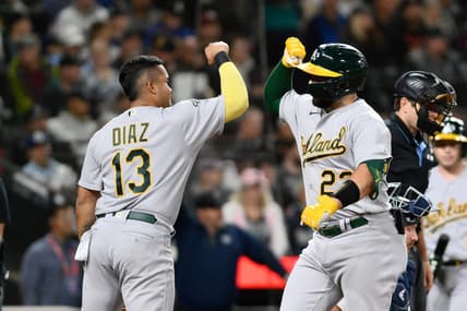Aug 29, 2023; Seattle, Washington, USA; Oakland Athletics third baseman Jordan Diaz (13) and catcher Shea Langeliers (23) celebrate after Langeliers hit a 2-run home run against the Seattle Mariners during the second inning at T-Mobile Park. Mandatory Credit: Steven Bisig-USA TODAY Sports