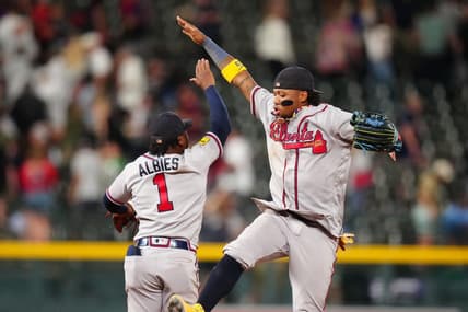 Aug 29, 2023; Denver, Colorado, USA; Atlanta Braves right fielder Ronald Acuna Jr. (13) and second baseman Ozzie Albies (1) celebrate defeating the Colorado Rockies at Coors Field. Mandatory Credit: Ron Chenoy-USA TODAY Sports