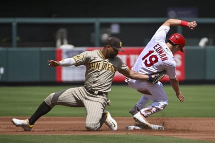 Aug 30, 2023; St. Louis, Missouri, USA;  St. Louis Cardinals center fielder Tommy Edman (19) slides safely past the tag of San Diego Padres shortstop Xander Bogaerts (2) for a stolen base during the first inning at Busch Stadium. Mandatory Credit: Jeff Curry-USA TODAY Sports