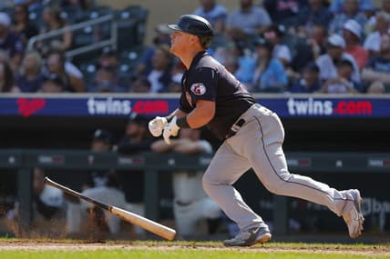 Aug 30, 2023; Minneapolis, Minnesota, USA; Cleveland Guardians first baseman Kole Calhoun (56) hits a three-run home run against the Minnesota Twins in the tenth inning at Target Field. Mandatory Credit: Bruce Kluckhohn-USA TODAY Sports