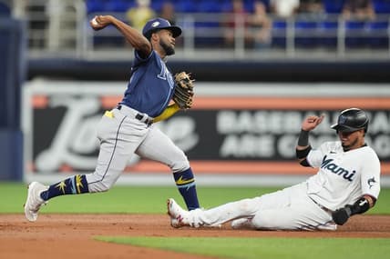Aug 30, 2023; Miami, Florida, USA; Tampa Bay Rays shortstop Osleivis Basabe (37) completes a double play as Miami Marlins second baseman Luis Arraez (3) slides into second base in the first inning at loanDepot Park. Mandatory Credit: Jim Rassol-USA TODAY Sports