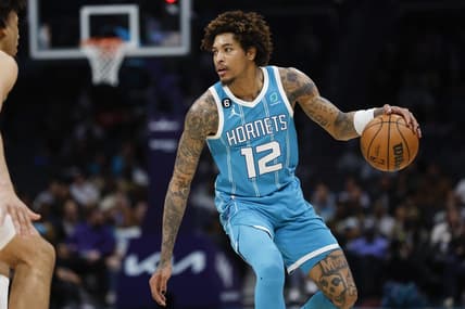 Mar 20, 2023; Charlotte, North Carolina, USA; Charlotte Hornets guard Kelly Oubre Jr. (12) runs the offense against the Indiana Pacers during the second half at Spectrum Center. Mandatory Credit: Nell Redmond-USA TODAY Sports