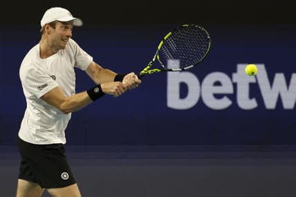 Mar 26, 2023; Miami, Florida, US; Botic van de Zandschulp (NED) hits a backhand against Casper Ruud (NOR) (not pictured) on day seven of the Miami Open at Hard Rock Stadium. Mandatory Credit: Geoff Burke-USA TODAY Sports