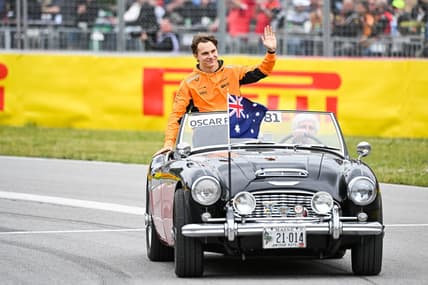 Jun 18, 2023; Montreal, Quebec, CAN; McLaren driver Oscar Piastri (AUS) parades and salutes the crowd before the Canadian Grand Prix at Circuit Gilles Villeneuve. Mandatory Credit: David Kirouac-USA TODAY Sports