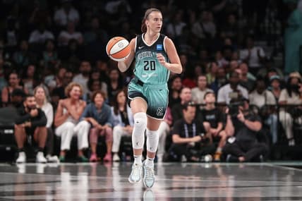 Aug 6, 2023; Brooklyn, New York, USA; New York Liberty guard Sabrina Ionescu (20) brings the ball up in the first quarter against the Las Vegas Aces at Barclays Center. Mandatory Credit: Wendell Cruz-USA TODAY Sports