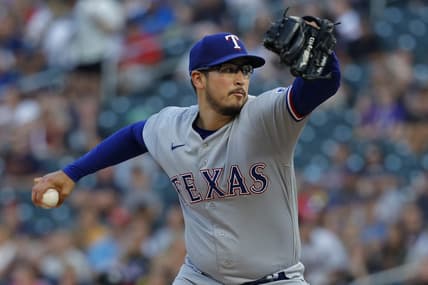 Aug 25, 2023; Minneapolis, Minnesota, USA; Texas Rangers starting pitcher Dane Dunning (33) throws to the Minnesota Twins in the first inning at Target Field. Mandatory Credit: Bruce Kluckhohn-USA TODAY Sports