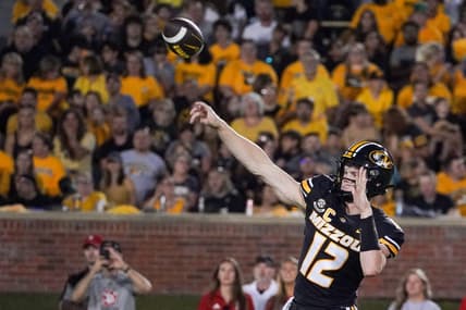 Aug 31, 2023; Columbia, Missouri, USA; Missouri Tigers quarterback Brady Cook (12) throws a pass against the South Dakota Coyotes during the first half at Faurot Field at Memorial Stadium. Mandatory Credit: Denny Medley-USA TODAY Sports