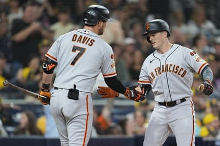 Aug 31, 2023; San Diego, California, USA;  San Francisco Giants right fielder Mike Yastrzemski (right) is congratulated by third baseman J.D. Davis (7) after hitting a home run against the San Diego Padres during the fifth inning at Petco Park. Mandatory Credit: Ray Acevedo-USA TODAY Sports
